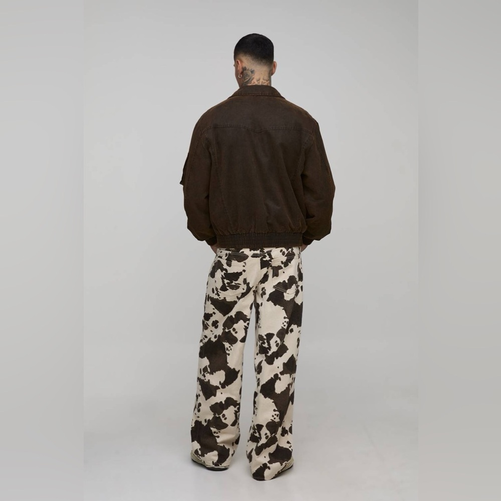 BoohooMAN Tall Washed Baggy Fit Cow Print Jeans - Picture 2 of 14